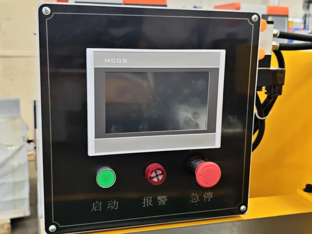 Touchscreen and push buttons on a cutting machine control station